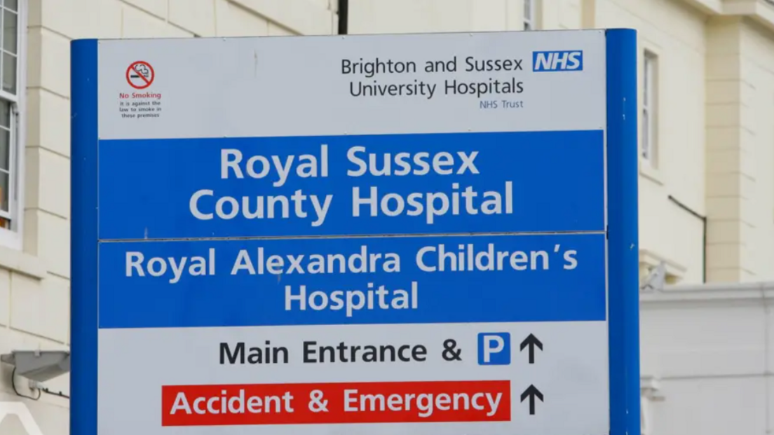 A sign outside the Royal Sussex County Hospital, with directions to the Main Entrance and the A&E department.