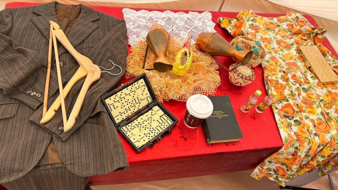 Clothes items that belonged to people from the Windrush generation who settled in the area.