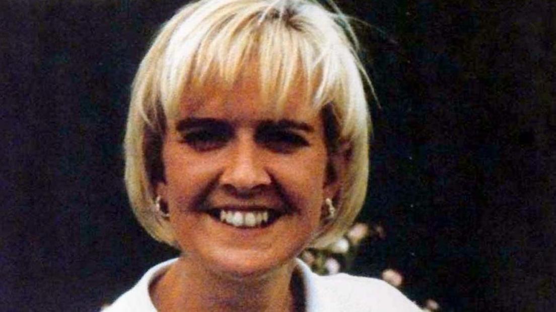 Blurry snap of the victim who is looking straight at the camera and smiling, showing very white teeth and a neat blond haircut.