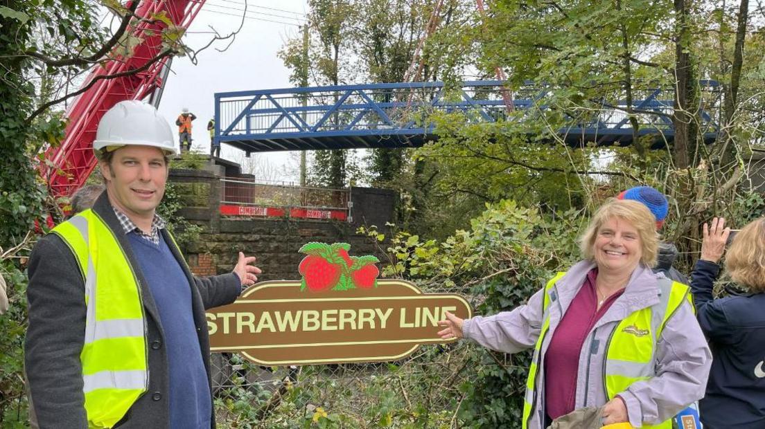 Councillors Richard Wilkins And Ros Wyke At The Installation Of The New Footbridge Over The B3136 West Shepton In Shepton Mallet.  