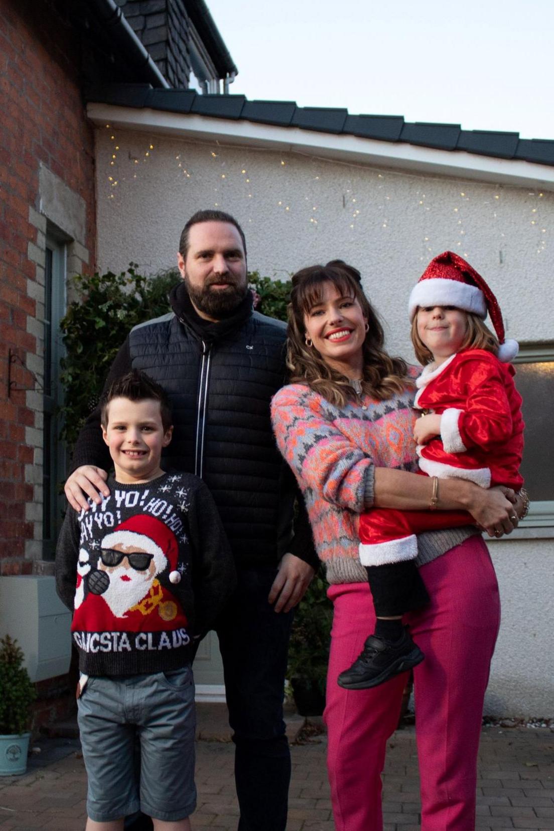 The family outside their house 