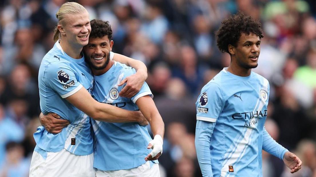 Man City players celebrate