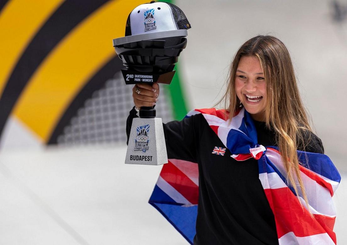 Sky Brown holding up a trophy. 