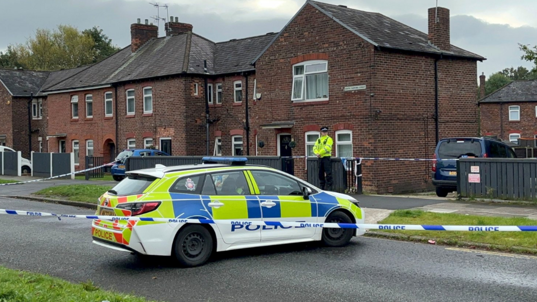 Police pictured at the scene of the home in South Radford Street