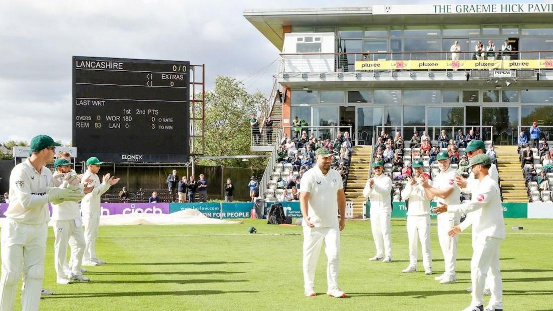 Retiring Pears paceman Joe Leach walks out to a guard of honour at Worcester