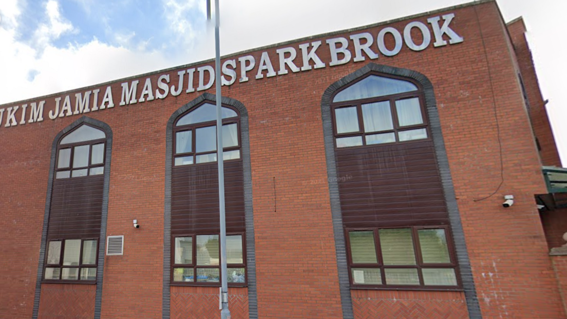 A two-storey brick building with 3 rows of windows