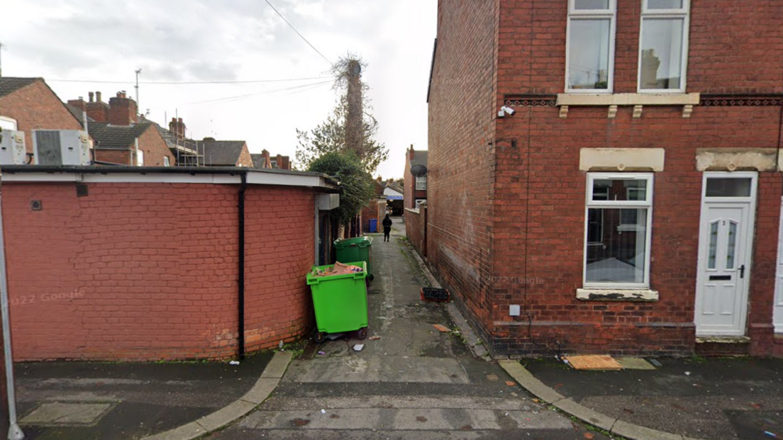 The alley between Apley Road and Whitburn Road in Doncaster - which has green bins and red brick houses