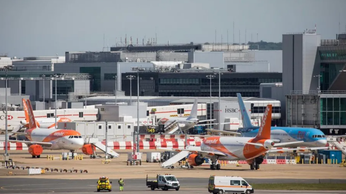 Planes on the runway at Gatwick Airport.