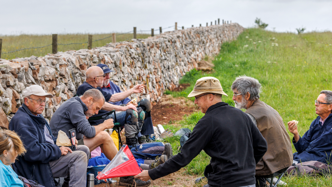 Drystone Wallers sat outside