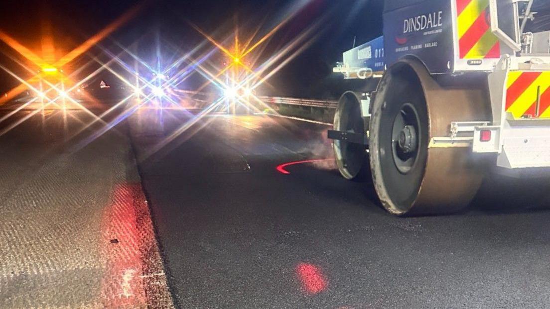 Raw and replaced road surface, with a road roller