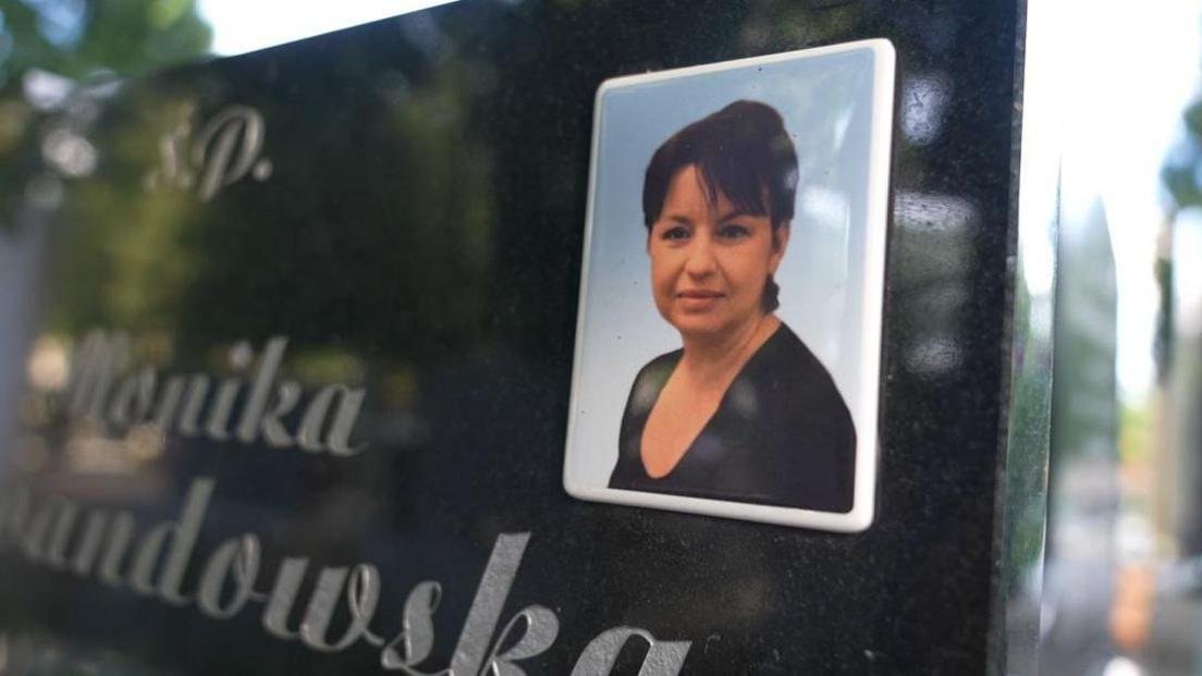 Close up of a picture of a woman on a headstone