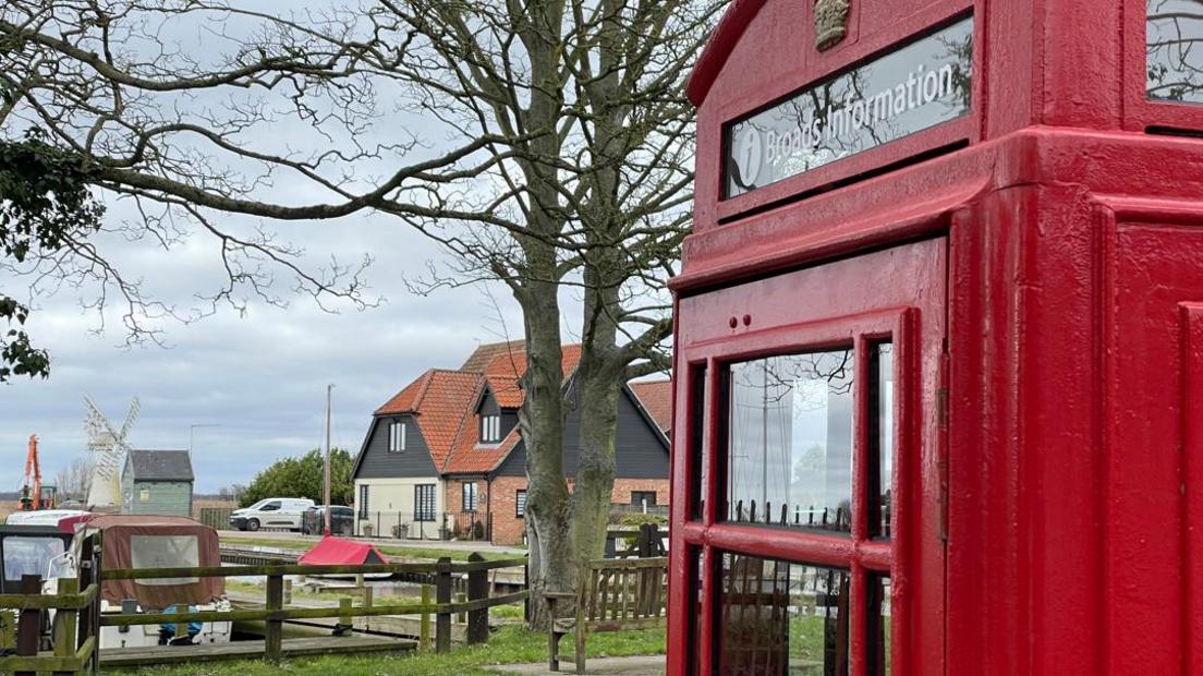 A visitor information centre in a red phonebox on the Norfolk Broads