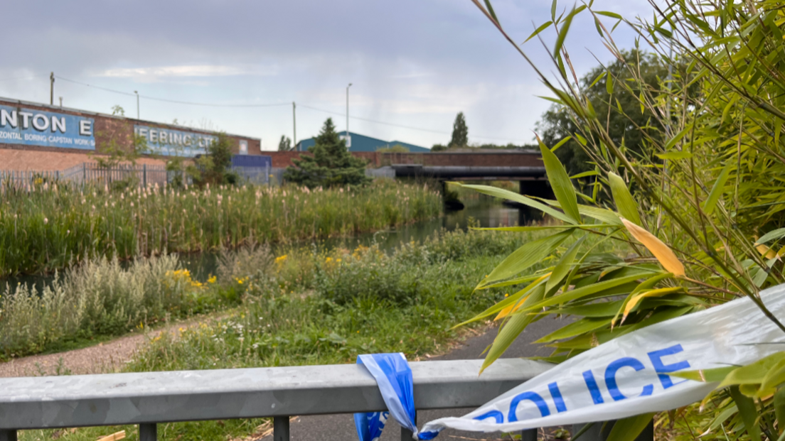 The canal with police tape in the foreground