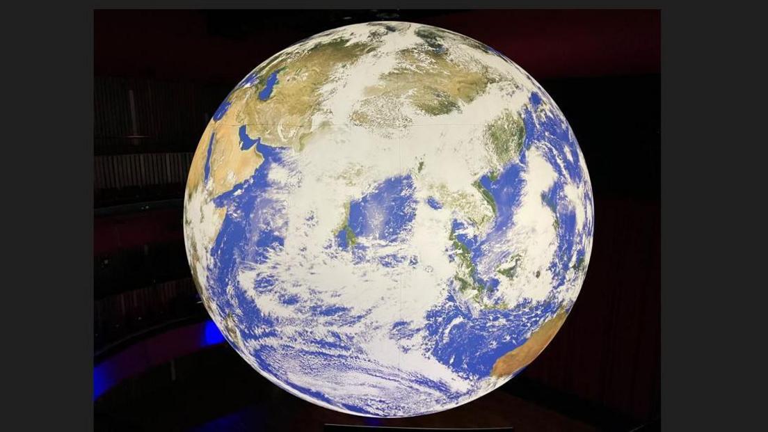 A large scale sculpture of Earth