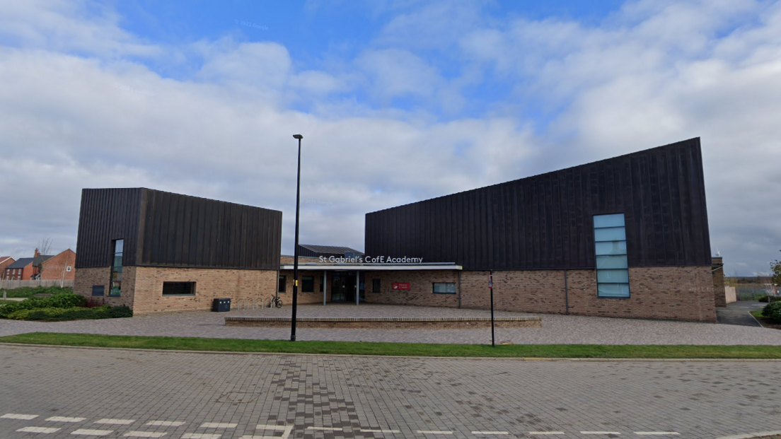 St Gabriel's CofE Academy a half pale brick and half wooden cladded primary school 