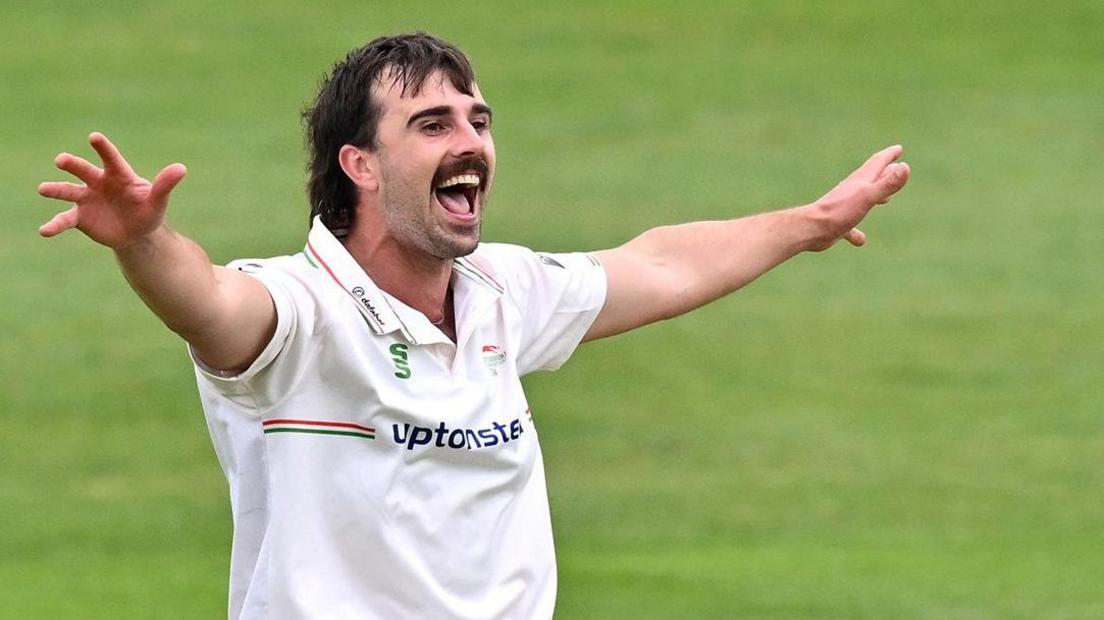 Ben Green celebrates taking a wicket for Leicestershire