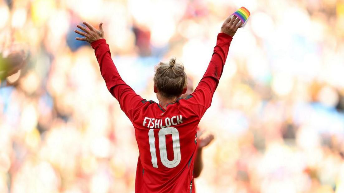Jess Fishlock waves goodbye as she leaves the pitch