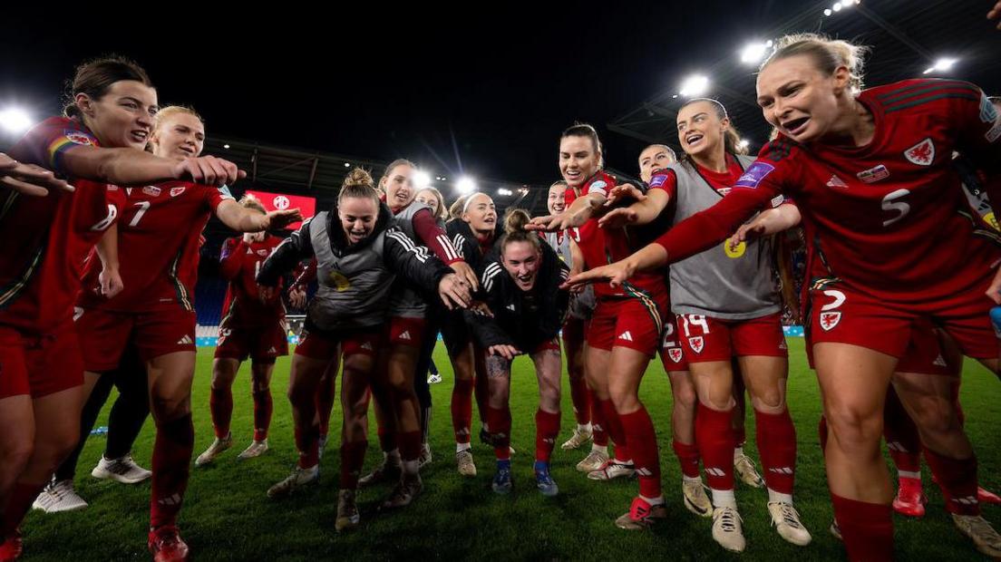 Wales players celebrate their extra time win over Slovakia 