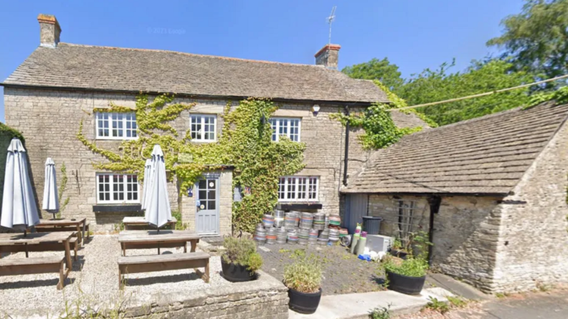 A close-up of the front of the Wheatsheaf Inn in Oaksey