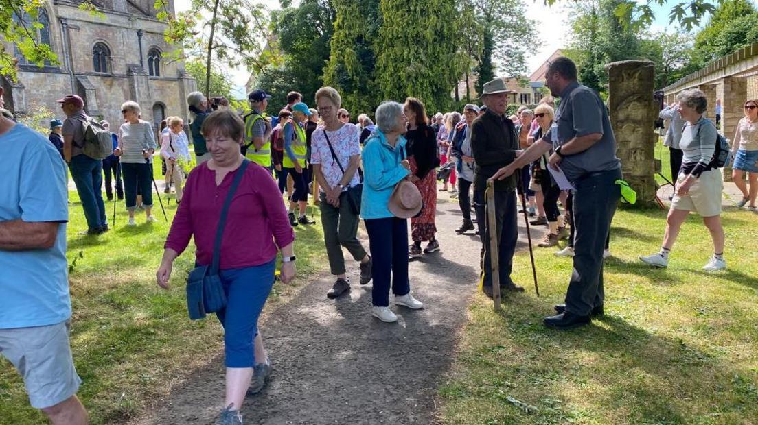 A group of walkers setting off from Church