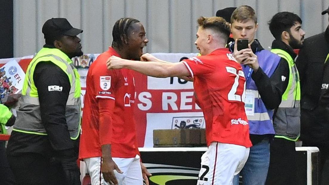 Reyes Cleary and Patrick Kelly celebrate a goal by Barnsley
