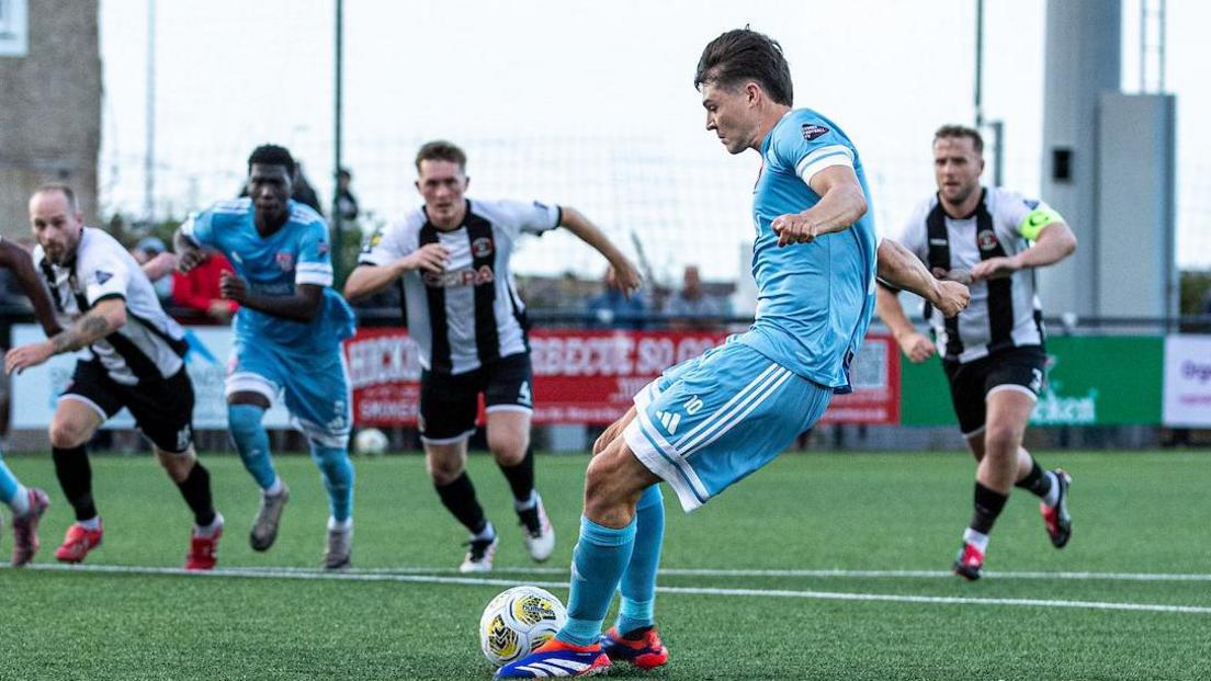 Joe Malkin scored from the penalty spot to give Flint the lead at Llandudno