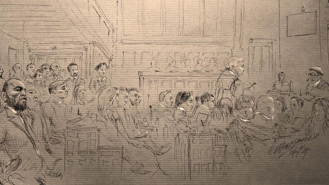 An artist's sketch of inside a packed courtroom - it is pencil drawing on paper, which shows a packed courtroom. The judge is to the right hand side and Conor McGregor is on the left. 