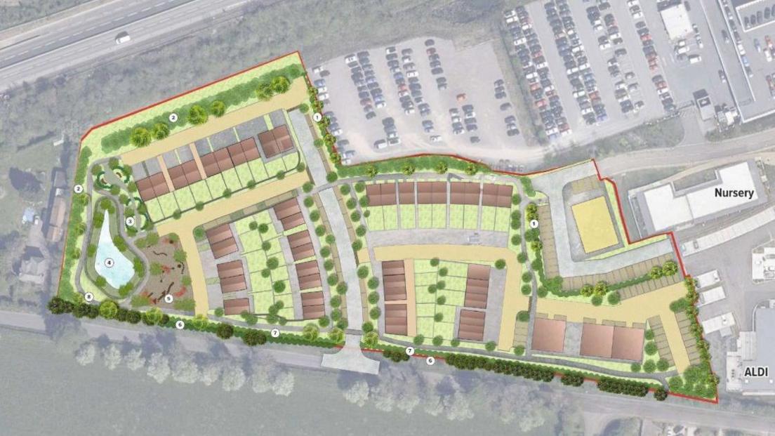 A top down view of the plans, showing roads and streets laid out and plans for a pond on the left of the site