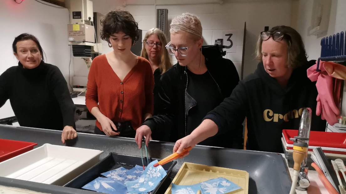 People using a photography darkroom