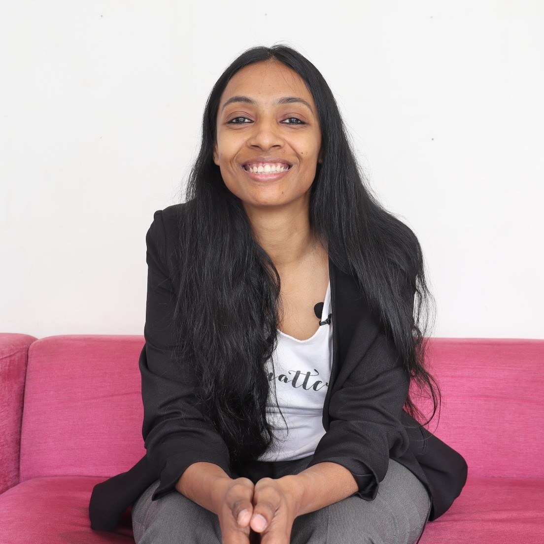 Pallavi on pink sofa