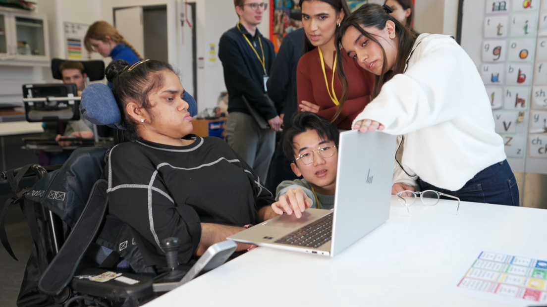 Richard Cloudesley School pupil Safiya being guided through MotionInput by UCL students