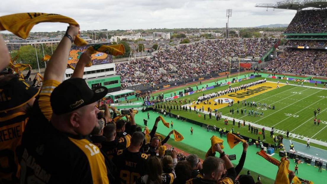 Pittsburgh Steelers fans waving towels at their game in Dublin
