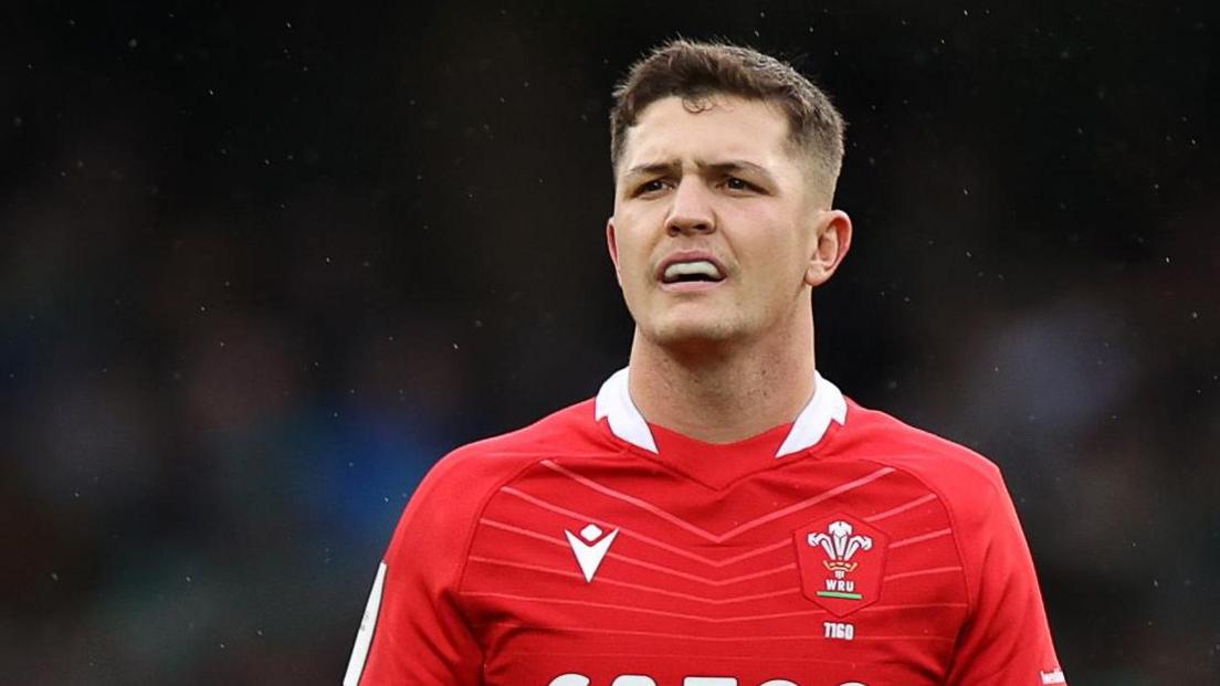 Callum Sheedy in a red Wales jersey