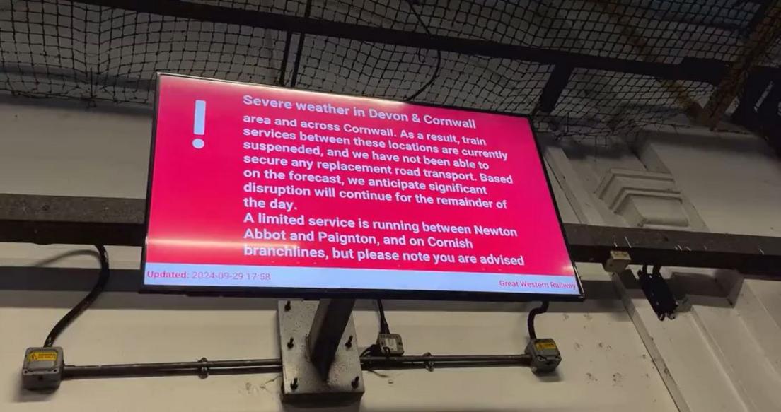 A red board at Exeter St David's reads: Severe weather in Devon & Cornwall. As a result, train services between these locations are currently suspended and we have not been able to secure any replacement road transport. Based on the forecast, we anticipate significant disruption will continue for the remainder of the day. A limited service is running between Newton Abbot and Paignton, and on Cornish branchlines. 