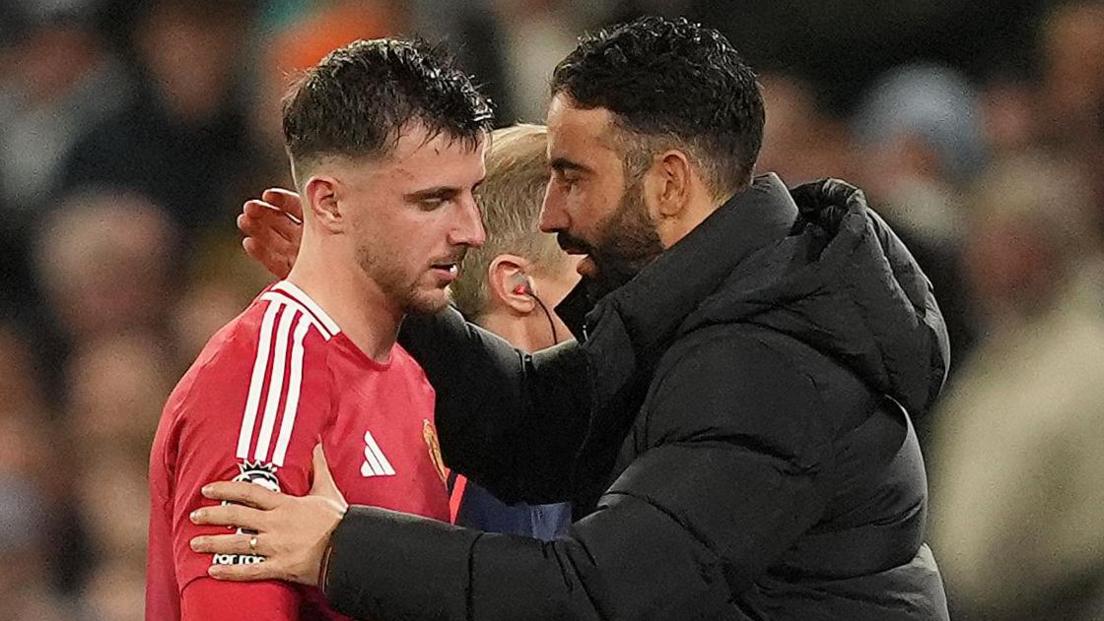 Manchester United head coach Ruben Amorim consoles Mason Mount after he comes off injured against Manchester City