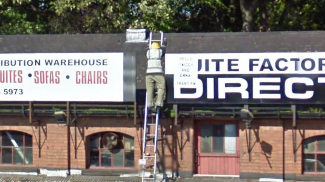 A Google Street View screen shot of the "Man on Ladder" in September 2011.