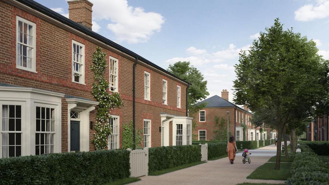 The computer generated image shows a woman walking and a child cycling on a path with hedges either side.
There are houses further back behind the gardens
