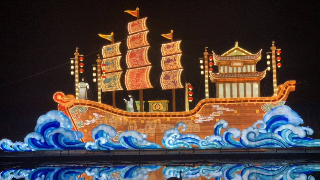 A large boat decoration, painted with a magical, oriental, feel and a dark background