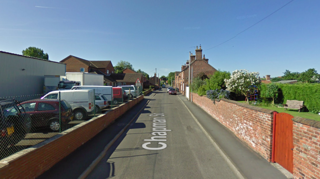 A Google Street View capture of Chapman Street in Market Rasen, a quiet residential street with terraced houses on the right and a petrol station and car forecourt to the left.