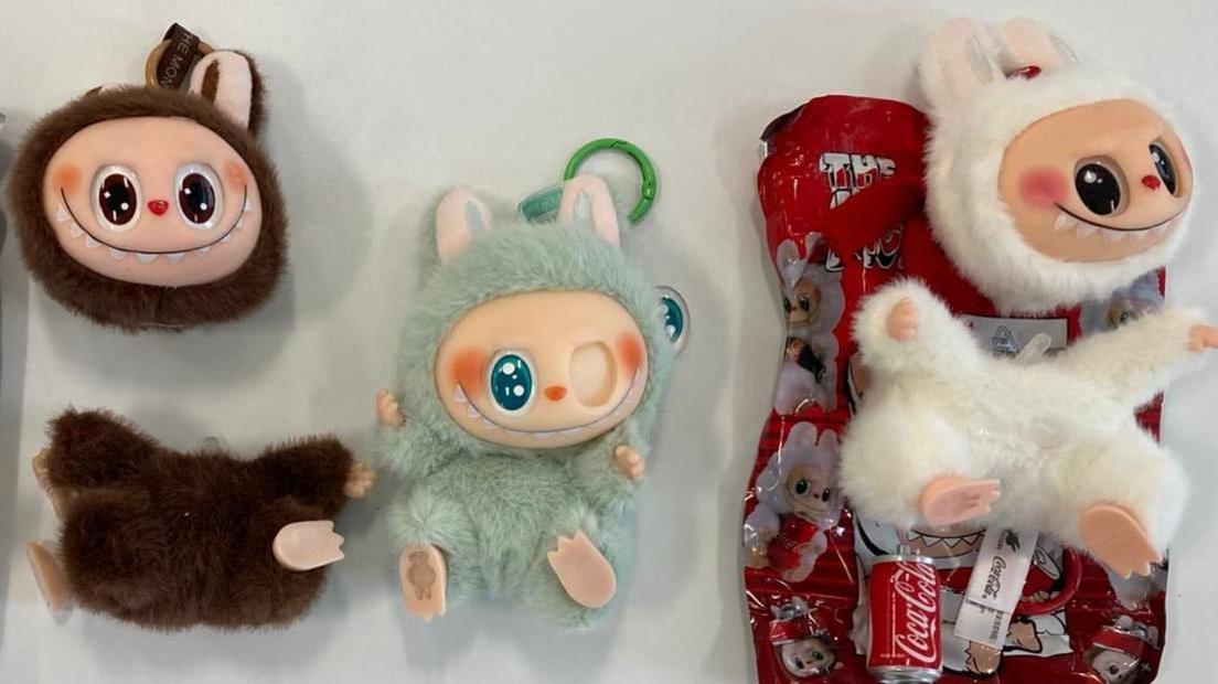 Three fake Labubu dolls - they all either have missing eyes or the head has come away from the body.