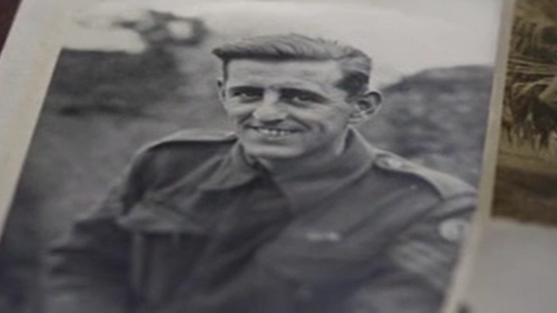 Tony Johnson smiles for the camera in his uniform during World War Two