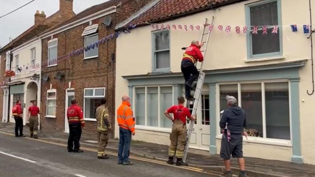 Bunting being hung up by fire officers