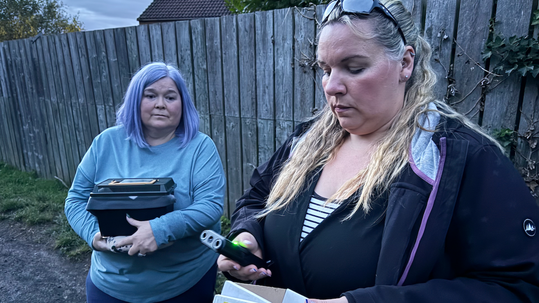 Julie Kilmartin, left, and wearing a blue top is holding a box which houses Nancy while Lauren Davison, right, is holding a bat detector which senses when similar breeds are nearby.