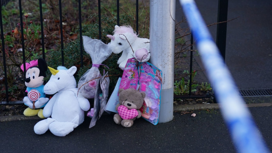 Toys and a card on street