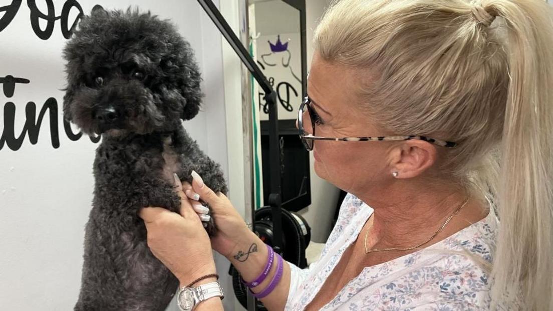 Claire with Fizz, a poochon