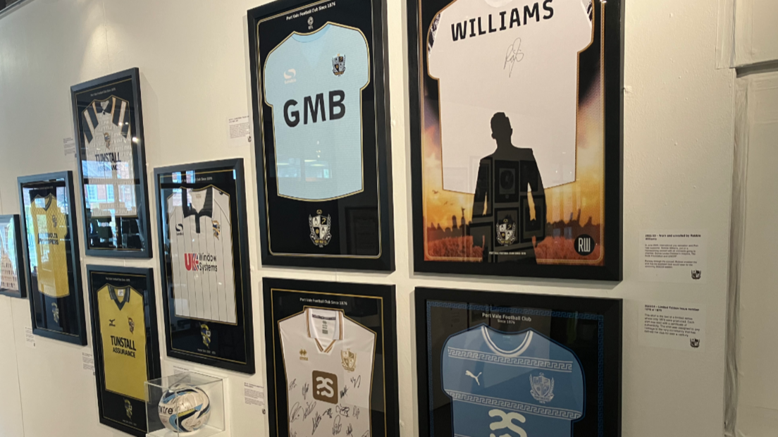 A number of framed Port Vale football shirts mounted on a wall