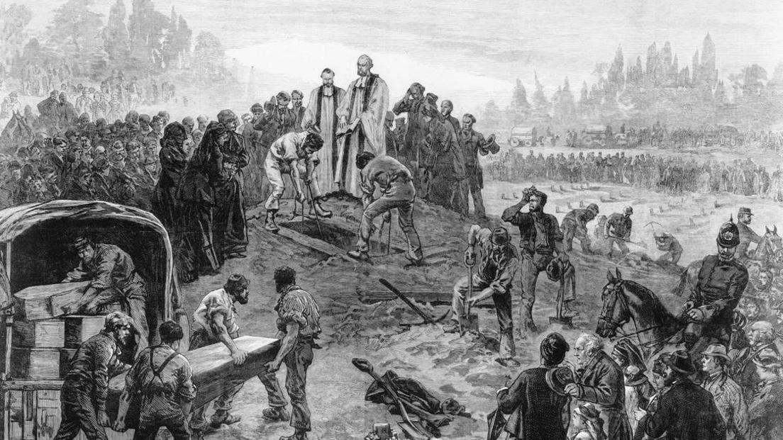 An image of a large group of people surrounding an open grave. People are carrying multiple coffins to the mass grave. Two vicars stand on a hill above the grave.