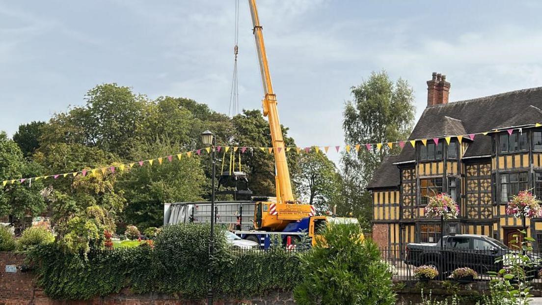 One of the sculptures being removed