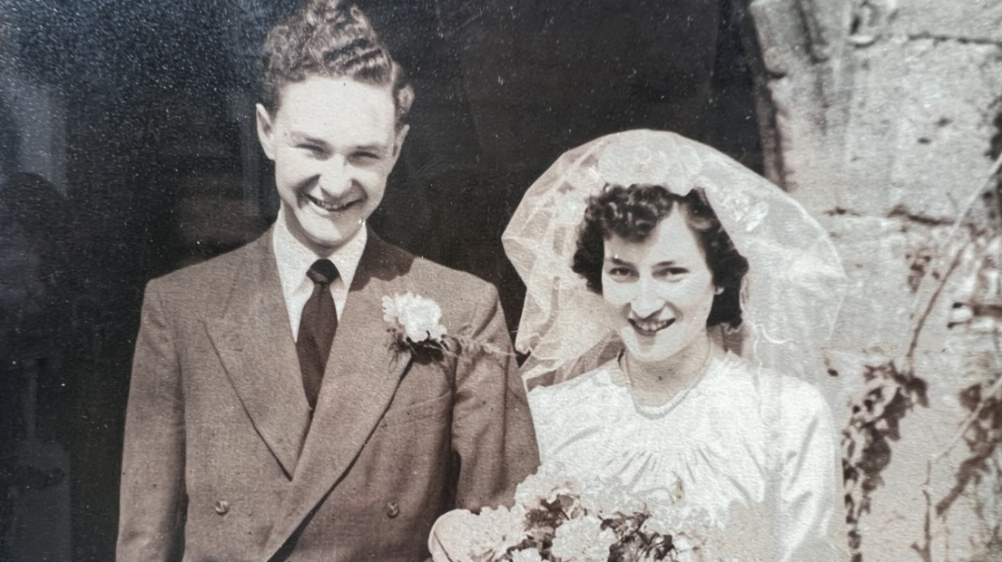 A black and white image of Barry and Betty Jones smiling on their wedding day