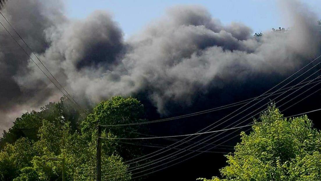 Image shows thick smoke in the area